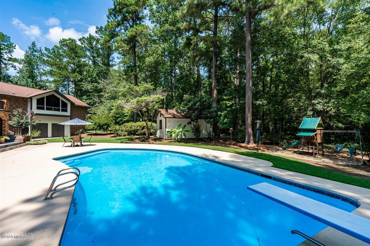 1225 Bass Road Macon, GA 31210 - Photo 49 of 58 a view of a house with swimming pool and sitting area