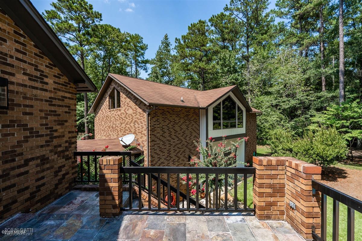 1225 Bass Road Macon, GA 31210 - Photo 55 of 58 a front view of a house with garden