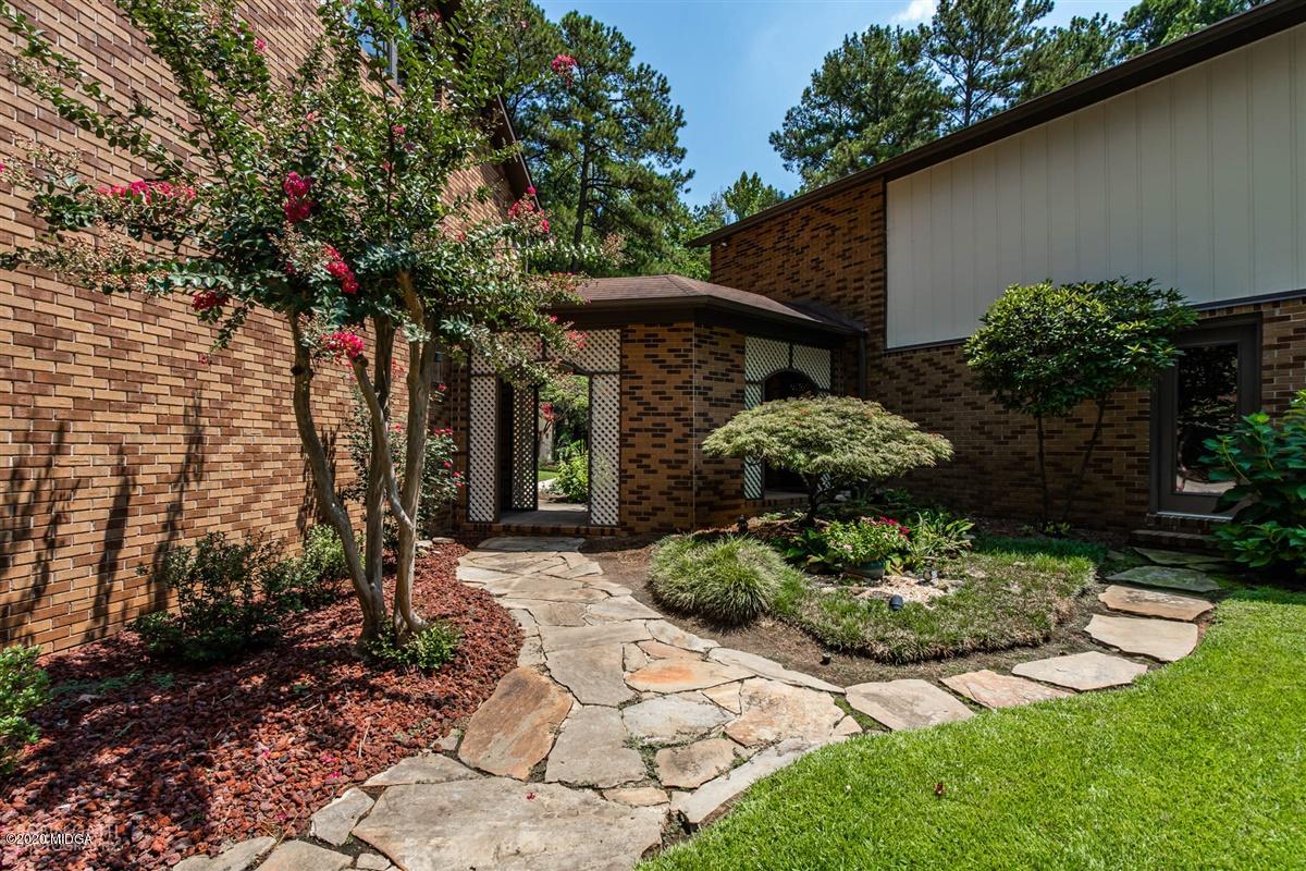 1225 Bass Road Macon, GA 31210 - Photo 56 of 58 a front view of a house with garden