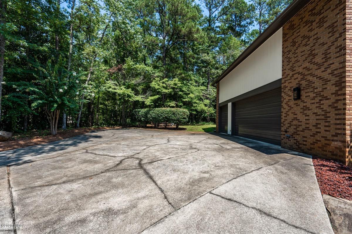 1225 Bass Road Macon, GA 31210 - Photo 58 of 58 a backyard of a house with lots of green space