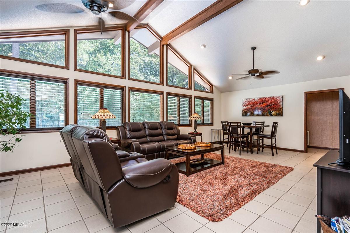 1225 Bass Road Macon, GA 31210 - Photo 7 of 58 a living room with furniture and a floor to ceiling window