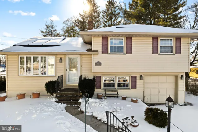 a backyard of a house with outdoor seating
