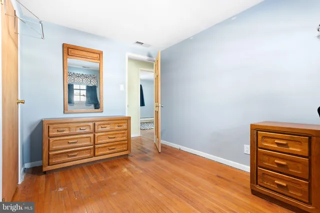 a view of room with wooden floor