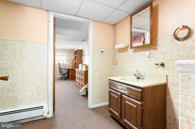 a bathroom with a sink and a mirror