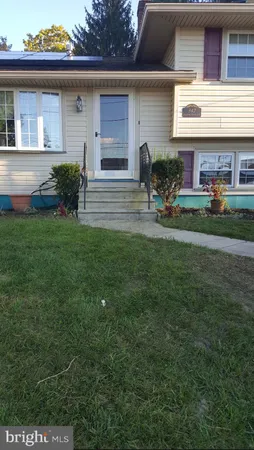 a front view of house with outdoor seating