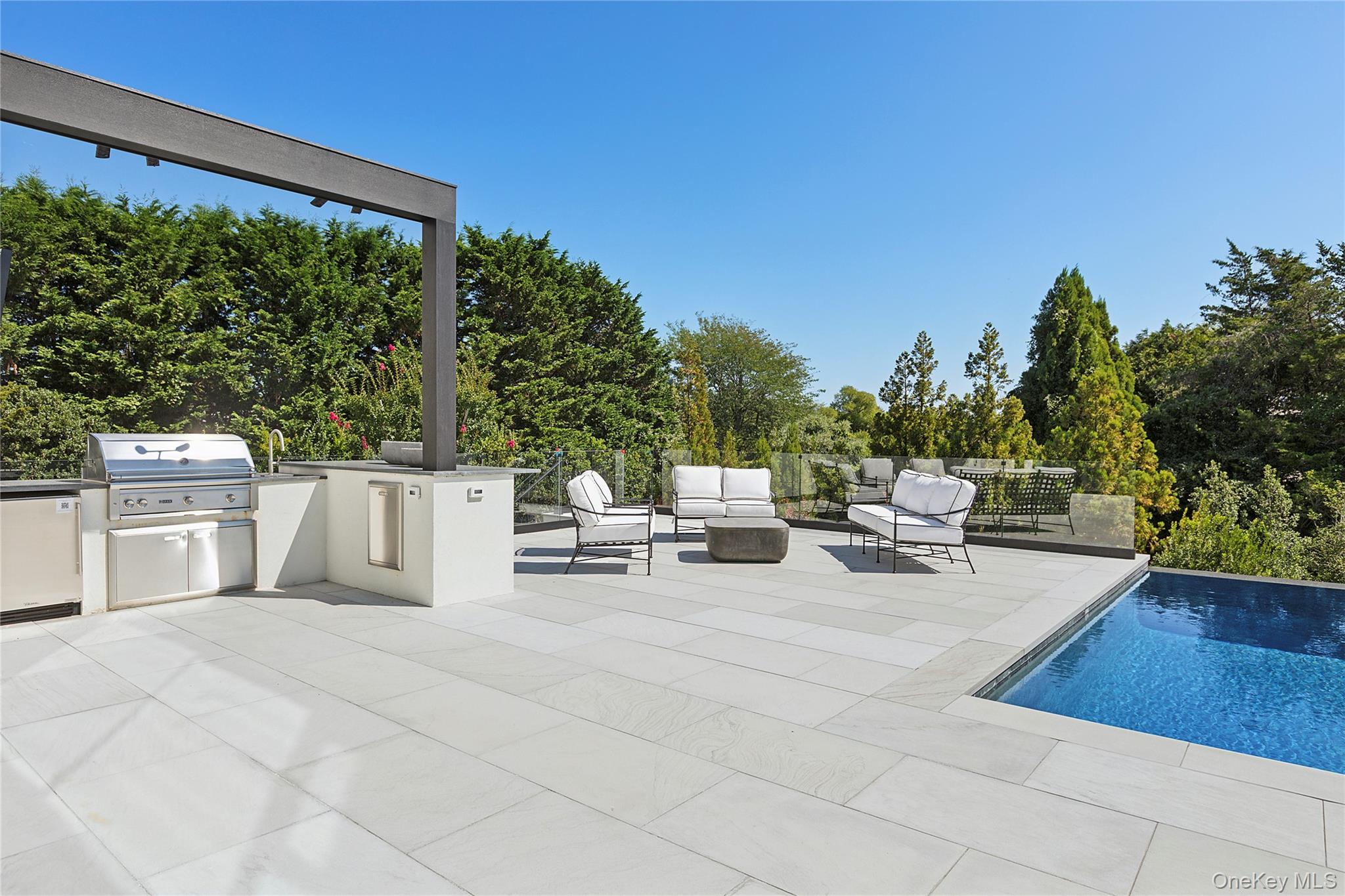 99 Pointe Mecox Lane Bridgehampton, NY 11976 - Photo 19 of 50 View of patio featuring area for grilling, outdoor lounge area, and an outdoor pool