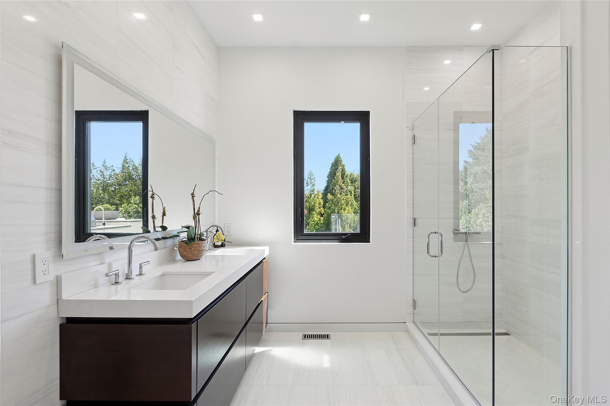 99 Pointe Mecox Lane Bridgehampton, NY 11976 - Photo 26 of 50 Bathroom featuring double vanity, a stall shower, and recessed lighting