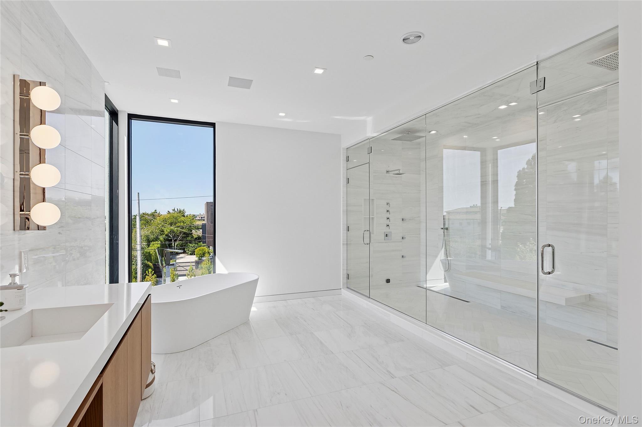 99 Pointe Mecox Lane Bridgehampton, NY 11976 - Photo 40 of 50 Bathroom featuring a freestanding bath, vanity, a shower stall, and recessed lighting