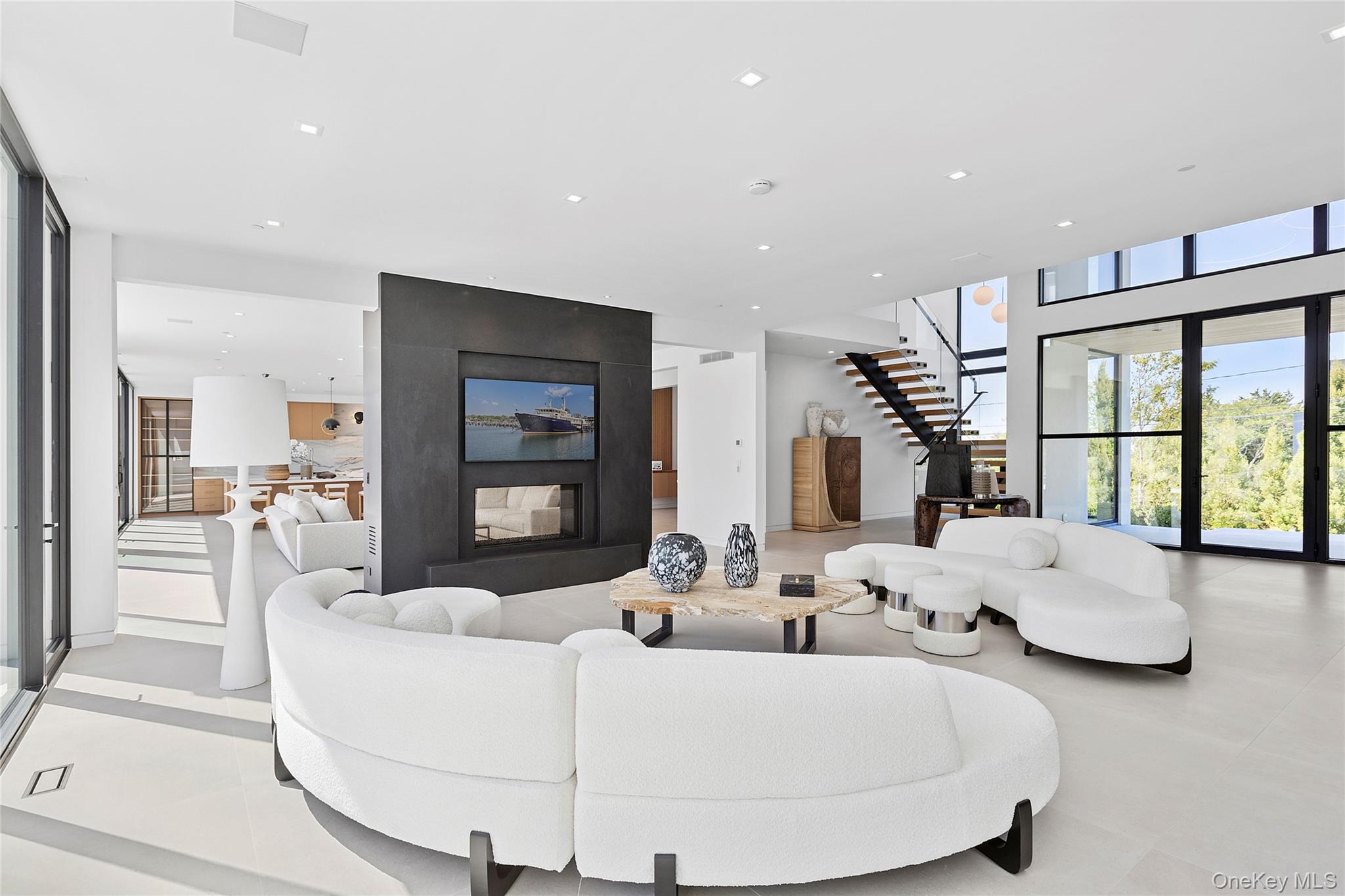 99 Pointe Mecox Lane Bridgehampton, NY 11976 - Photo 8 of 50 Living area with stairway and recessed lighting