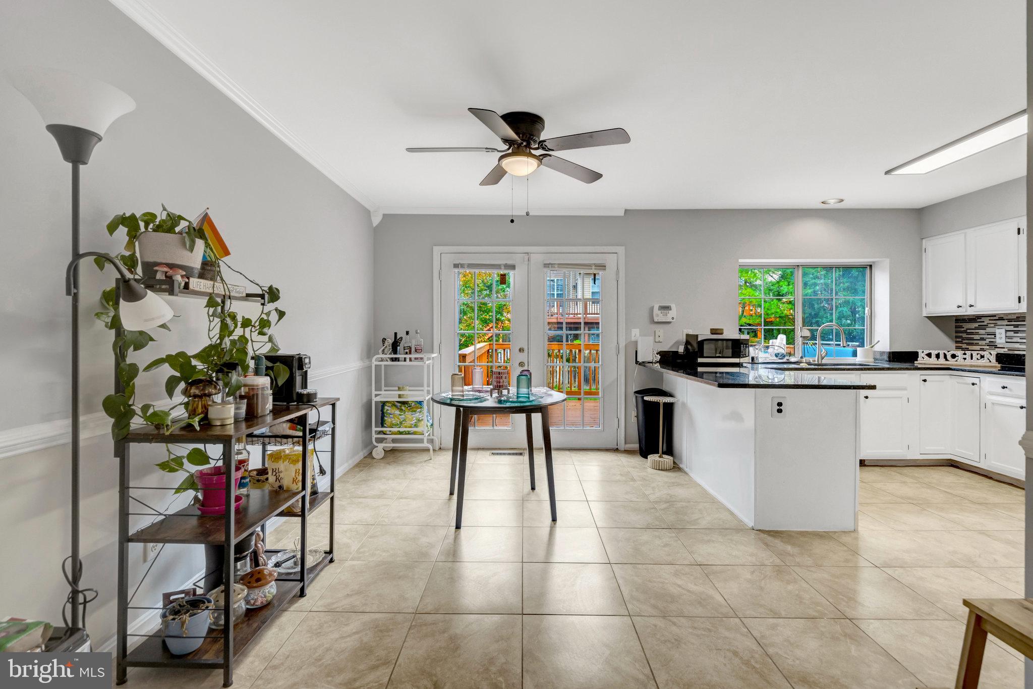 7905 Rebel Walk Drive Manassas, VA 20109 - Photo 11 of 51 a kitchen with kitchen island granite countertop lots of counter top space and furniture