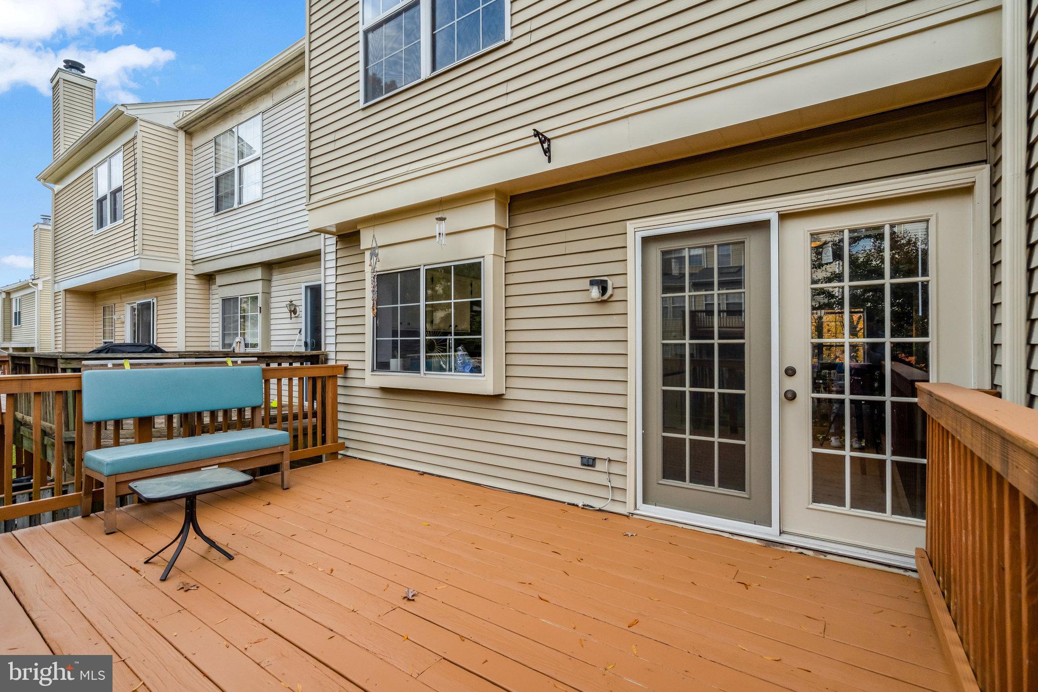 7905 Rebel Walk Drive Manassas, VA 20109 - Photo 20 of 51 a view of a house with wooden deck and a wooden fence