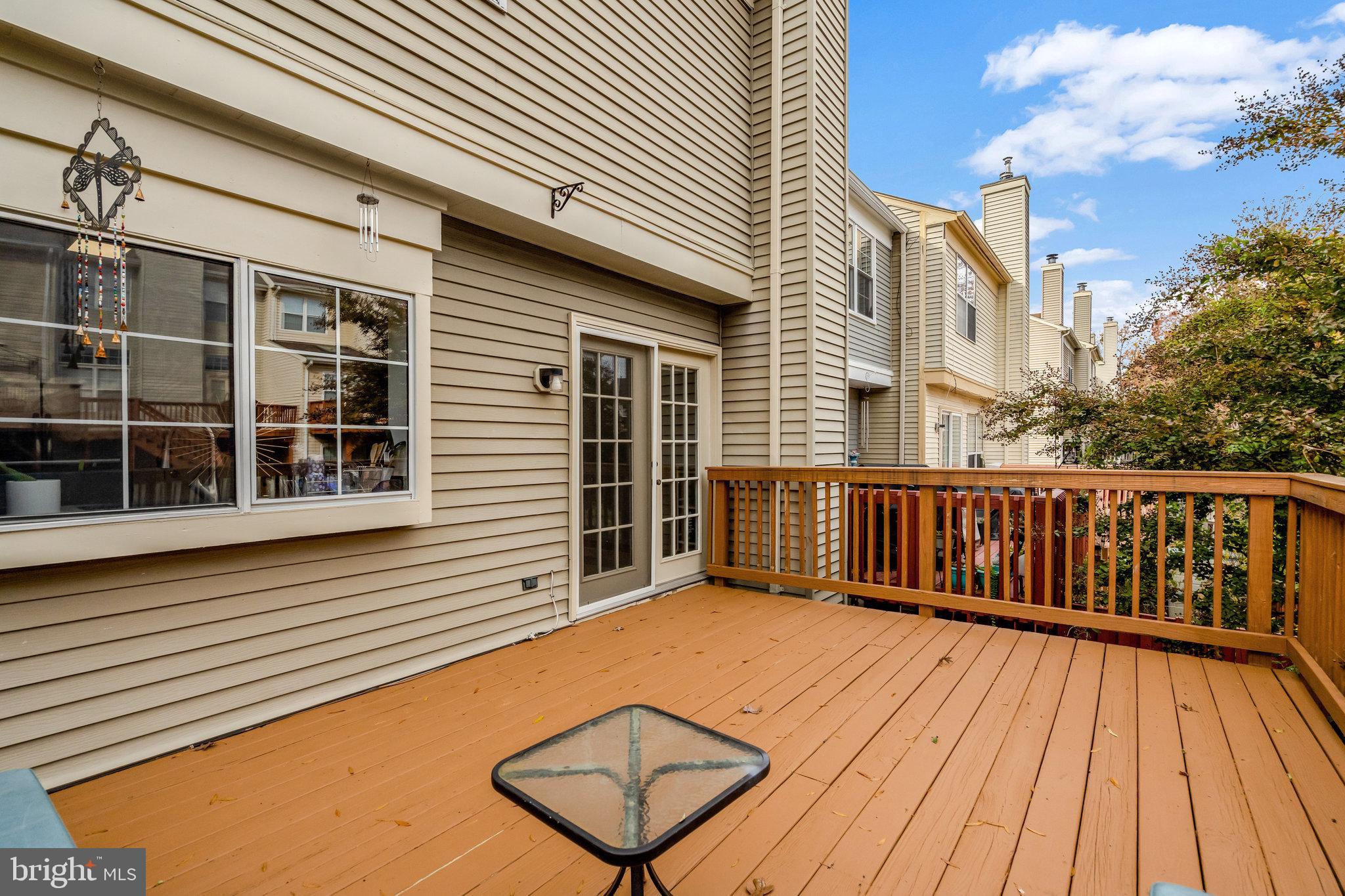 7905 Rebel Walk Drive Manassas, VA 20109 - Photo 21 of 51 a balcony with a table and chairs