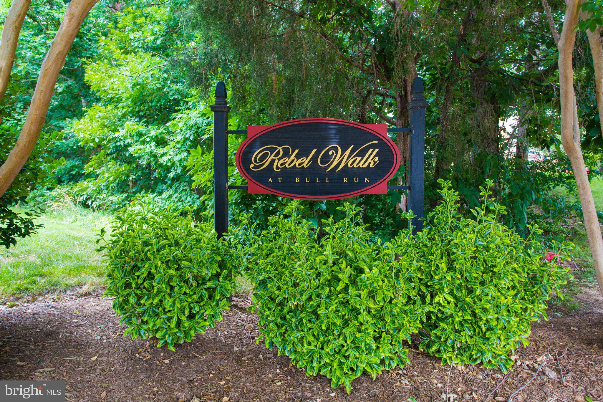 7905 Rebel Walk Drive Manassas, VA 20109 - Photo 3 of 51 a sign that is sitting in a forest