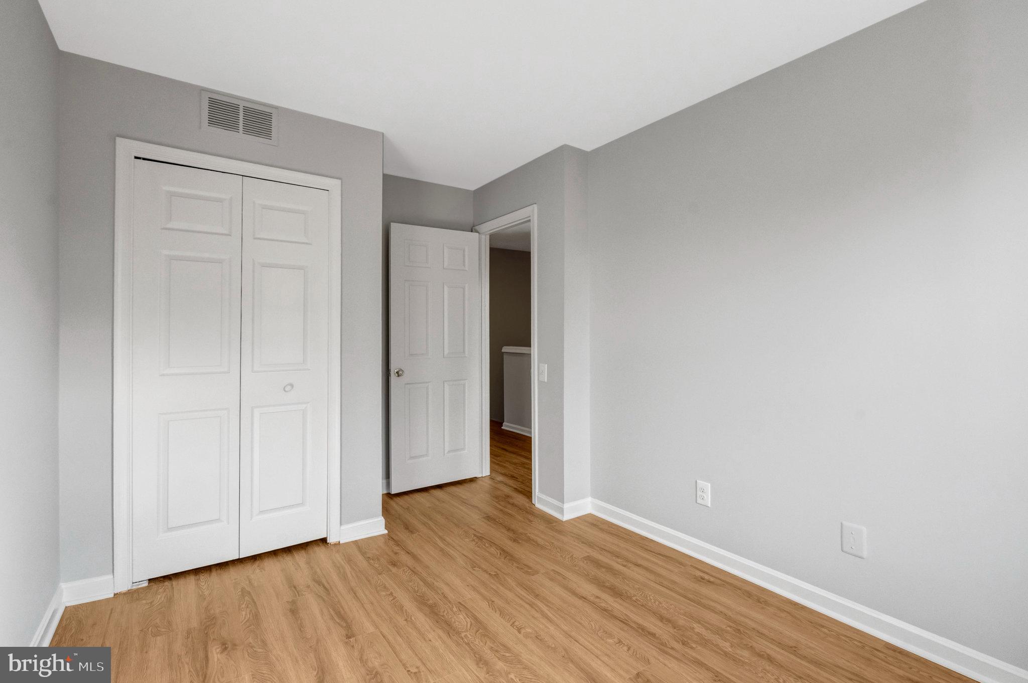 7905 Rebel Walk Drive Manassas, VA 20109 - Photo 37 of 51 a view of an empty room with wooden floor
