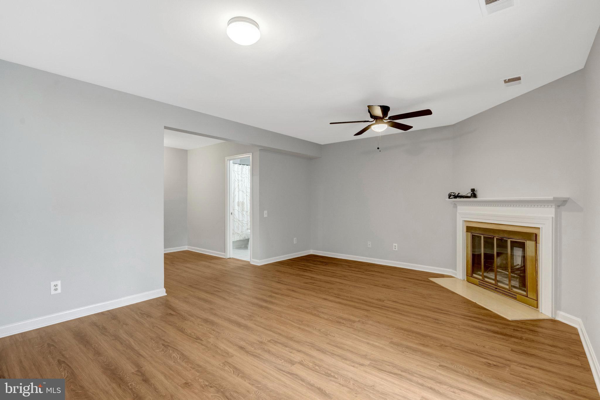 7905 Rebel Walk Drive Manassas, VA 20109 - Photo 40 of 51 a view of an empty room with a fireplace and a window
