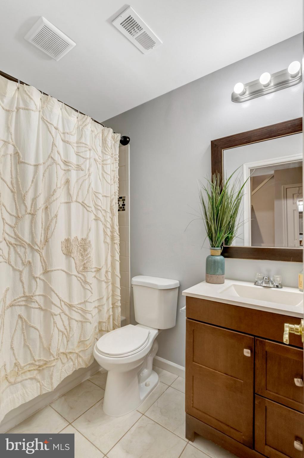 7905 Rebel Walk Drive Manassas, VA 20109 - Photo 42 of 51 a bathroom with a sink a toilet and a mirror