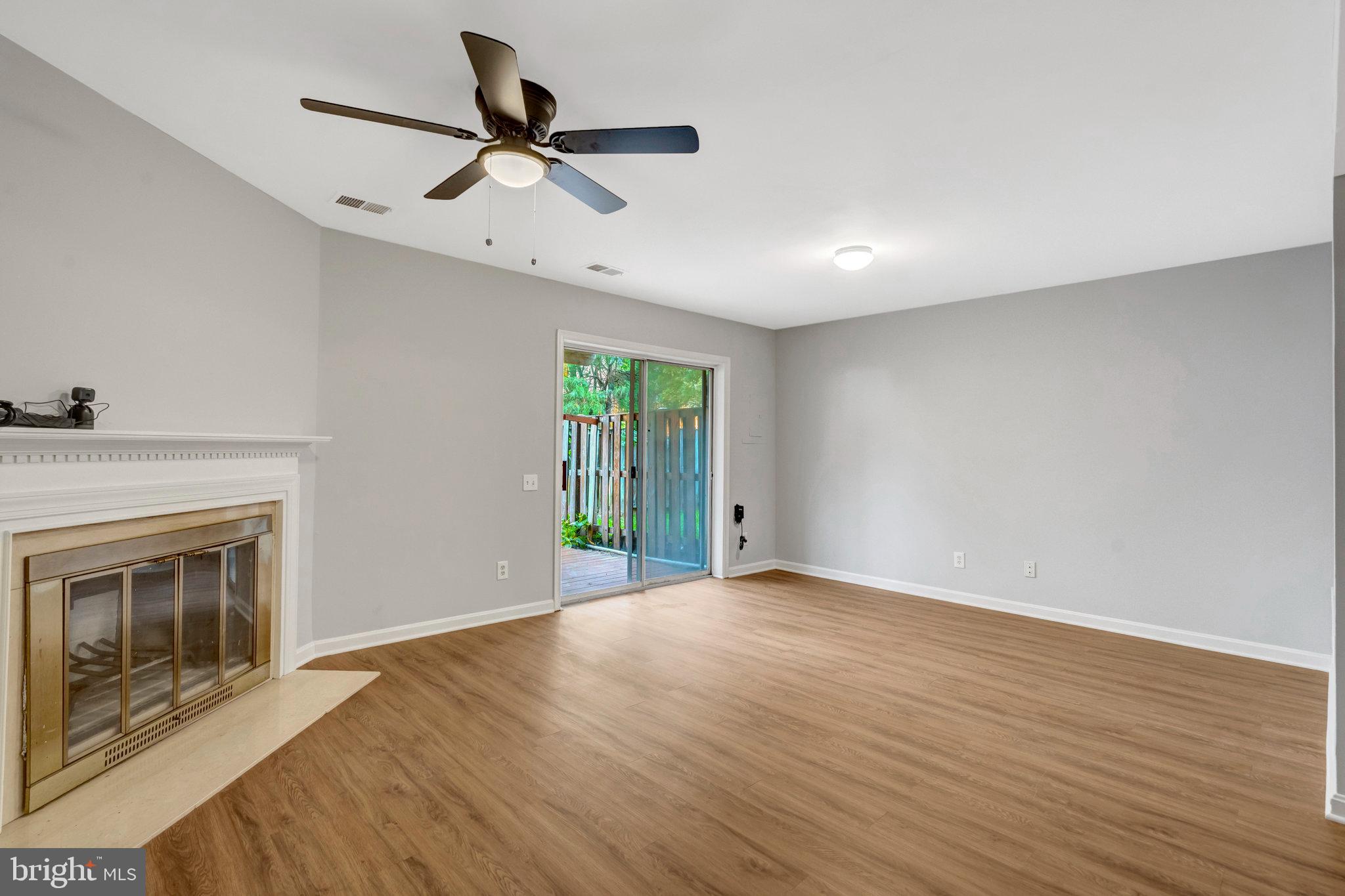 7905 Rebel Walk Drive Manassas, VA 20109 - Photo 43 of 51 a view of an empty room with a fireplace and a window