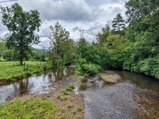 a view of lake with green space