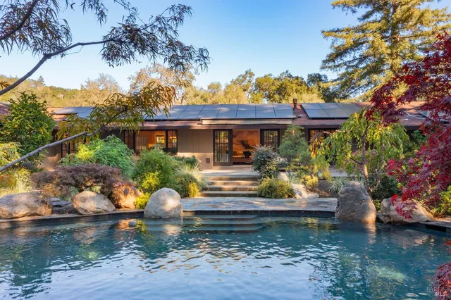 a front view of a house with garden