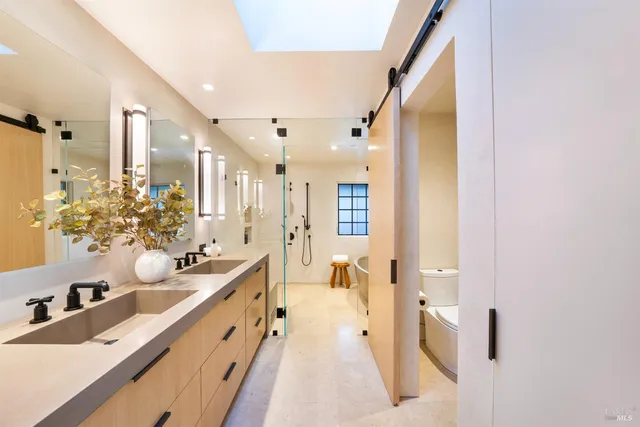 a living room with furniture large window and a flat screen tv