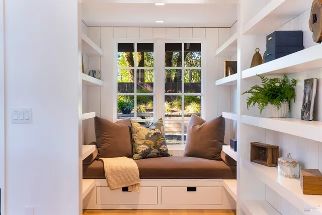 a kitchen with counter top space appliances and furniture