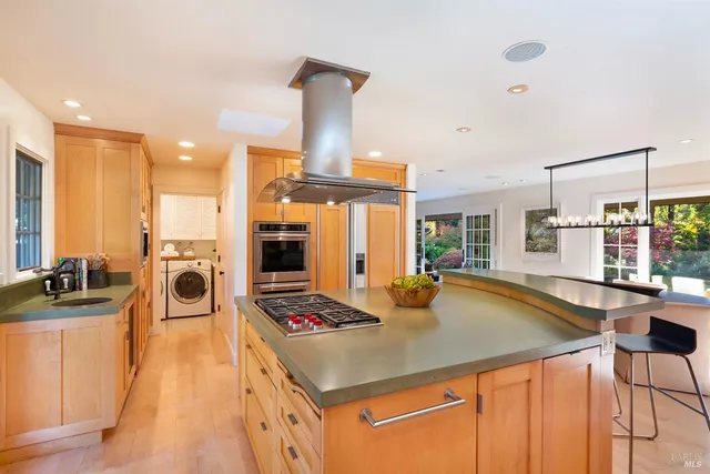 a bedroom with two beds and a large window