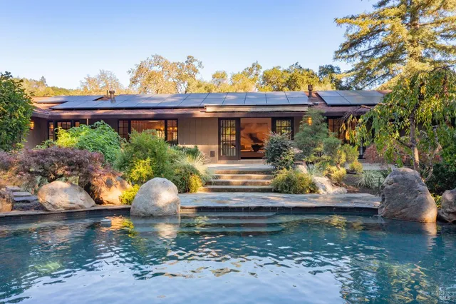 a view of a lake with boats and trees in the background