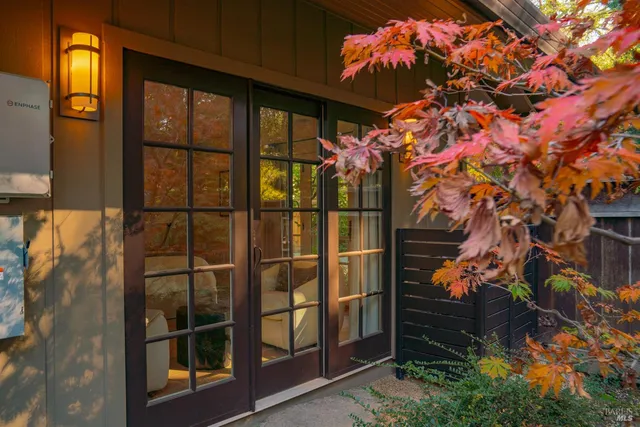 a view of a patio with table and chairs and potted plants