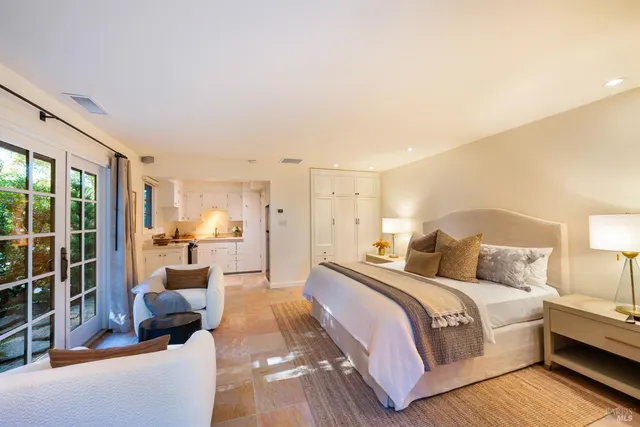 a view of a dining room with furniture and chandelier