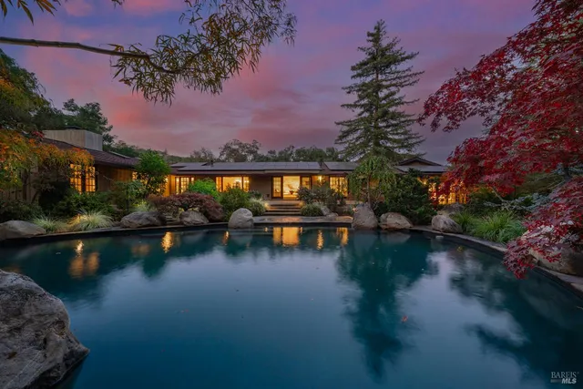 a bathroom with a double vanity sink toilet and shower