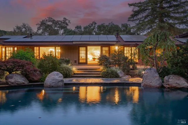 a spacious bathroom with a double vanity sink a mirror and shower