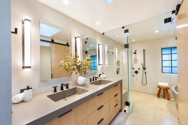 a bedroom with a bed and large window