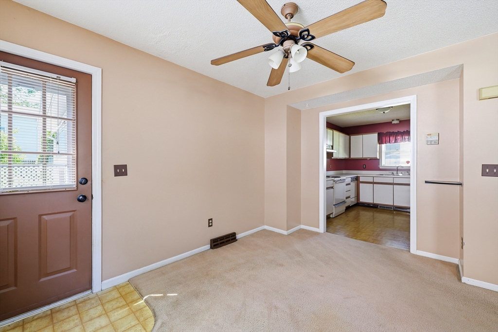 19-21 Wedgewood Circle Springfield, MA 01129 - Photo 10 of 32 a view of a bedroom with a bed and a chandelier fan