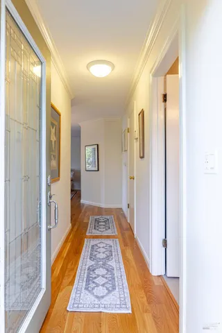 a bedroom with a bed and a potted plant