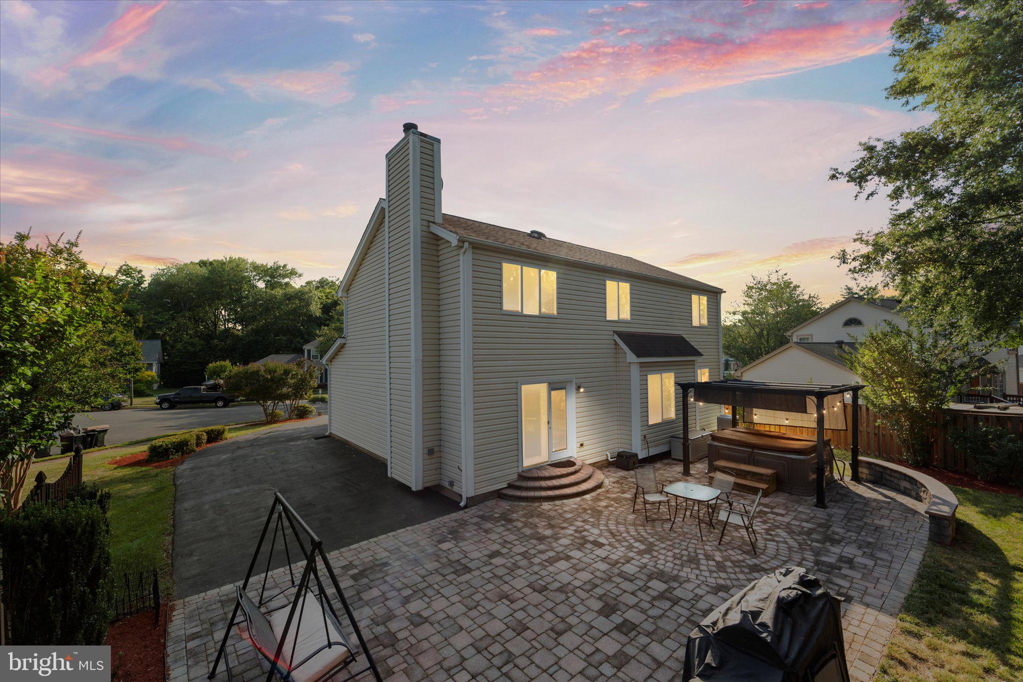 10461 Brackets Ford Circle Manassas, VA 20110 - Photo 36 of 52 Rear Exterior with Patio and Hot Tub