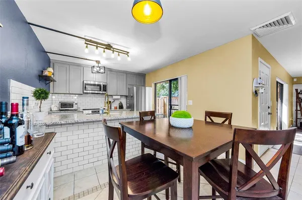 a view of kitchen dining table and chairs