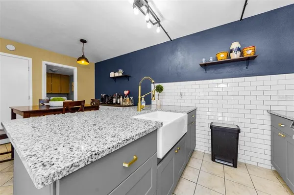 a bathroom with a sink a vanity and a mirror