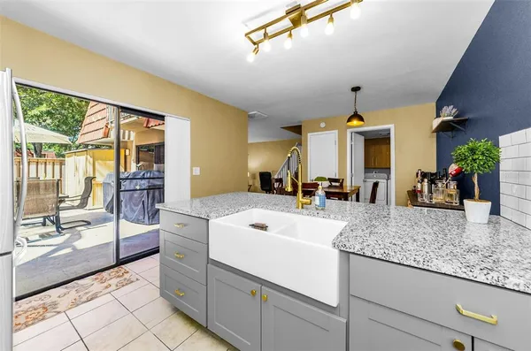 a view of a living room and kitchen