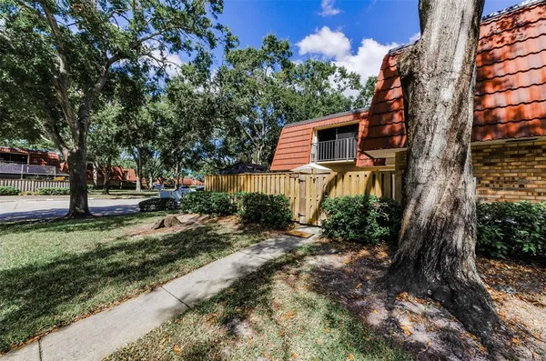 a backyard of a house with lots of green space