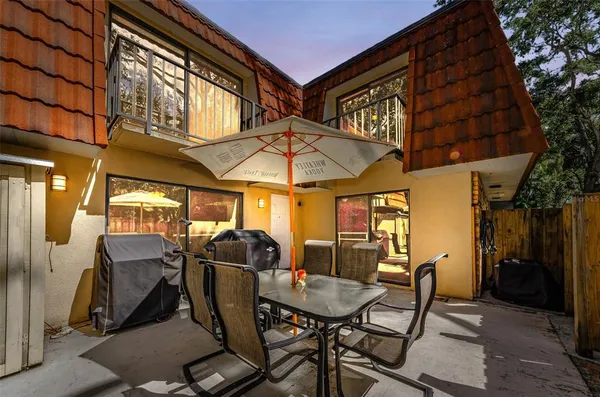 a view of a chairs and table in the patio