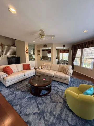 a living room with furniture rug and window