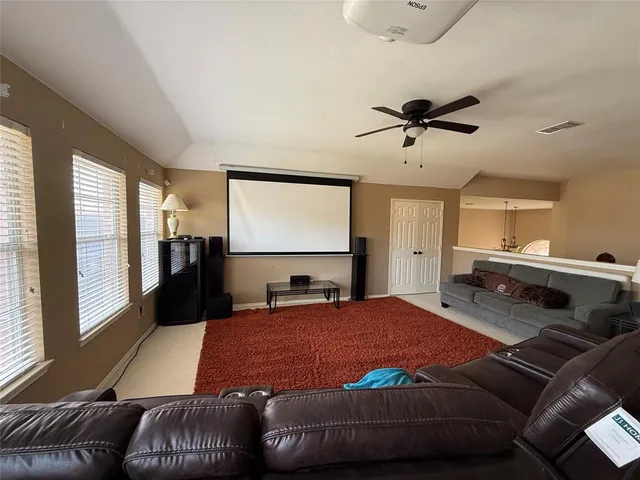 a bedroom with furniture and window
