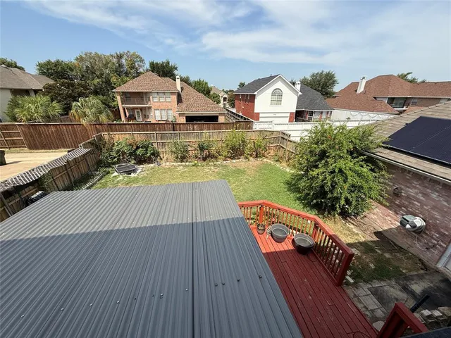 an outdoor view of house with wooden floor and outdoor space