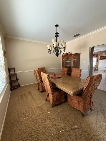 a room with furniture and a chandelier