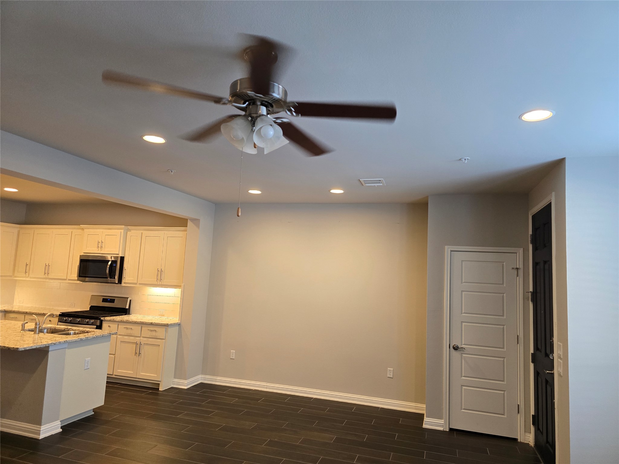 13800 Lyndhurst Street, Unit 233 Austin, TX 78717 - Photo 13 of 38 a view of a kitchen with a sink stainless steel appliances and cabinets