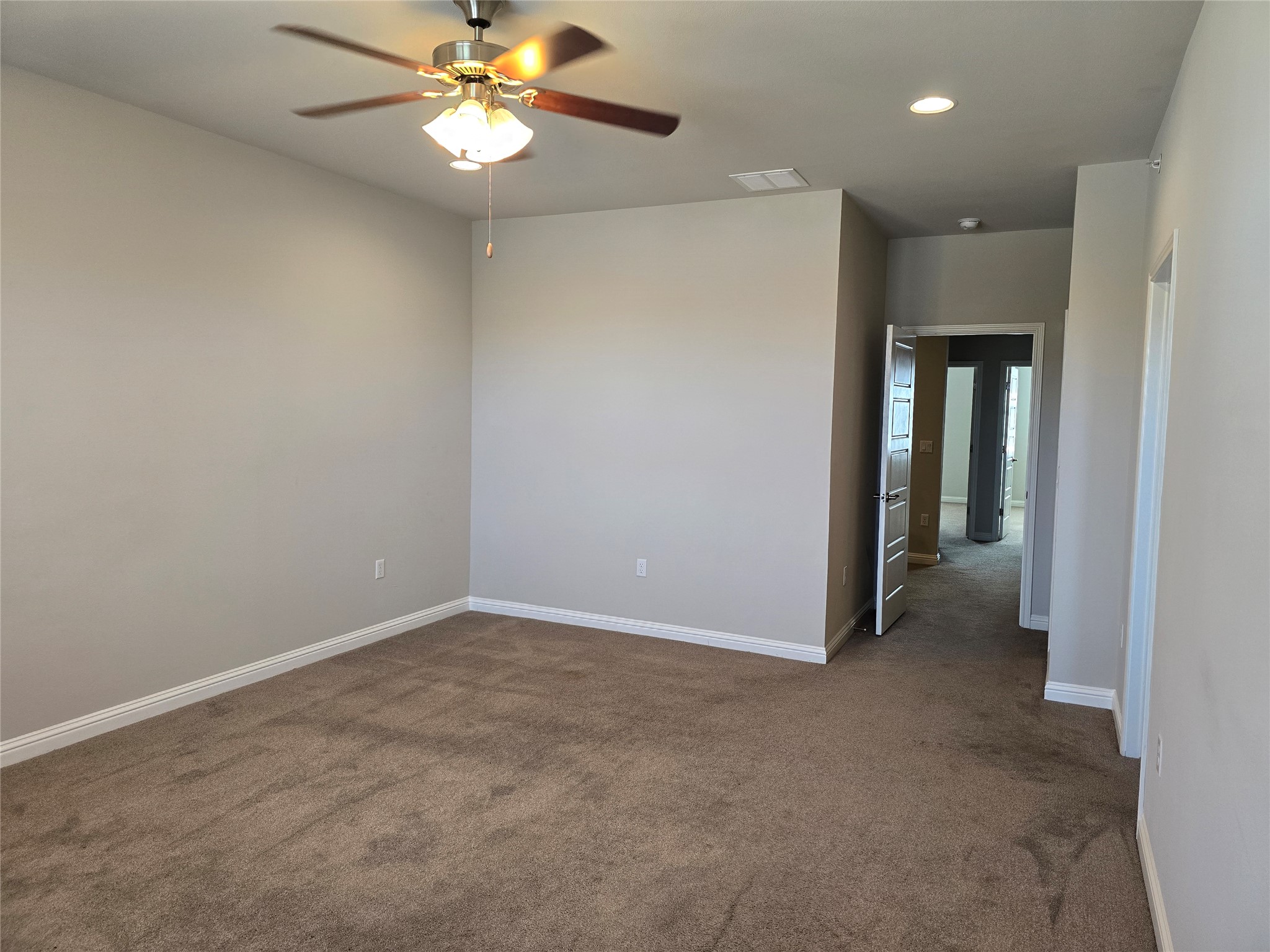 13800 Lyndhurst Street, Unit 233 Austin, TX 78717 - Photo 16 of 38 a view of an empty room with a ceiling fan