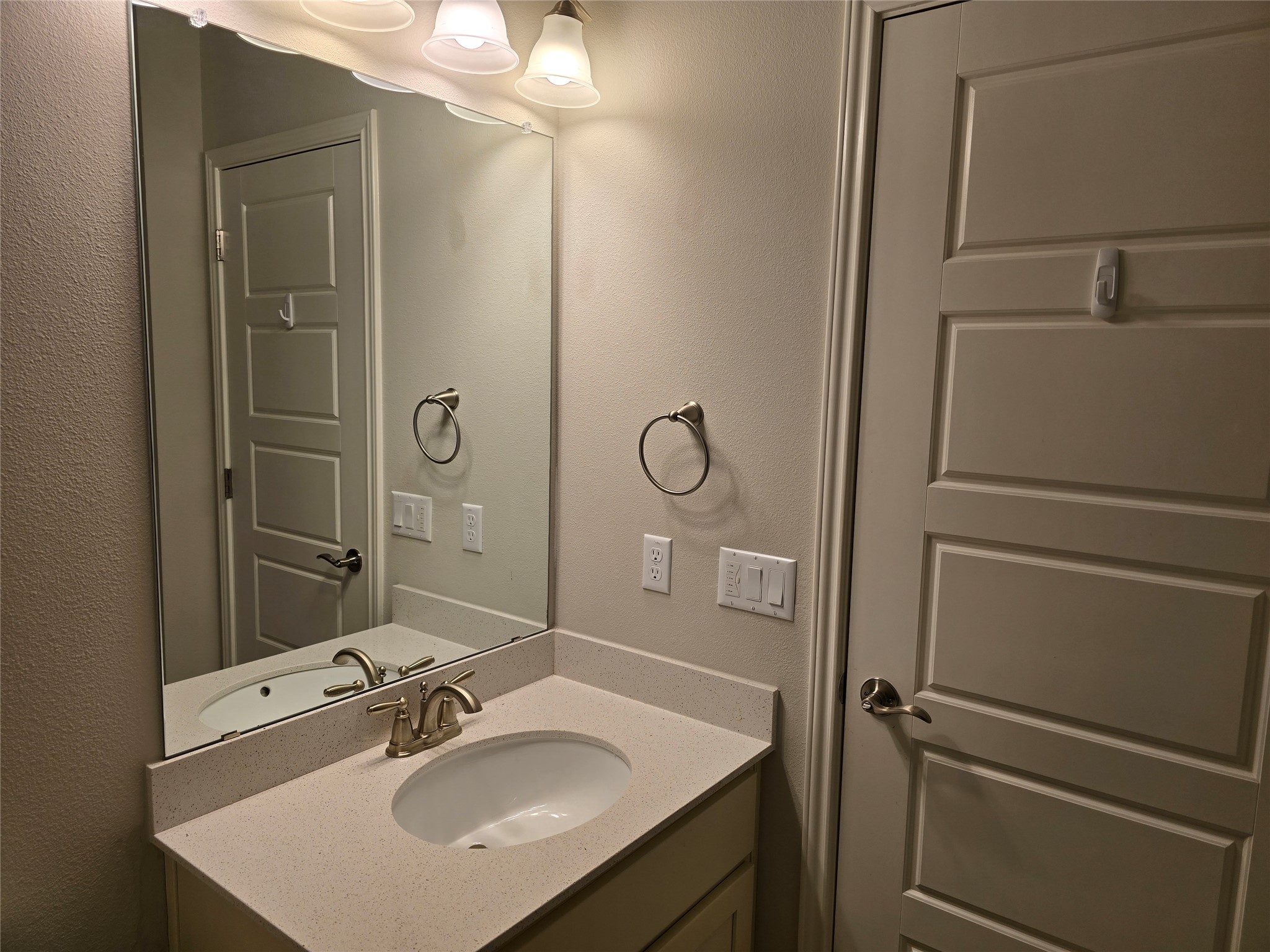 13800 Lyndhurst Street, Unit 233 Austin, TX 78717 - Photo 25 of 38 a bathroom with a sink vanity and mirror