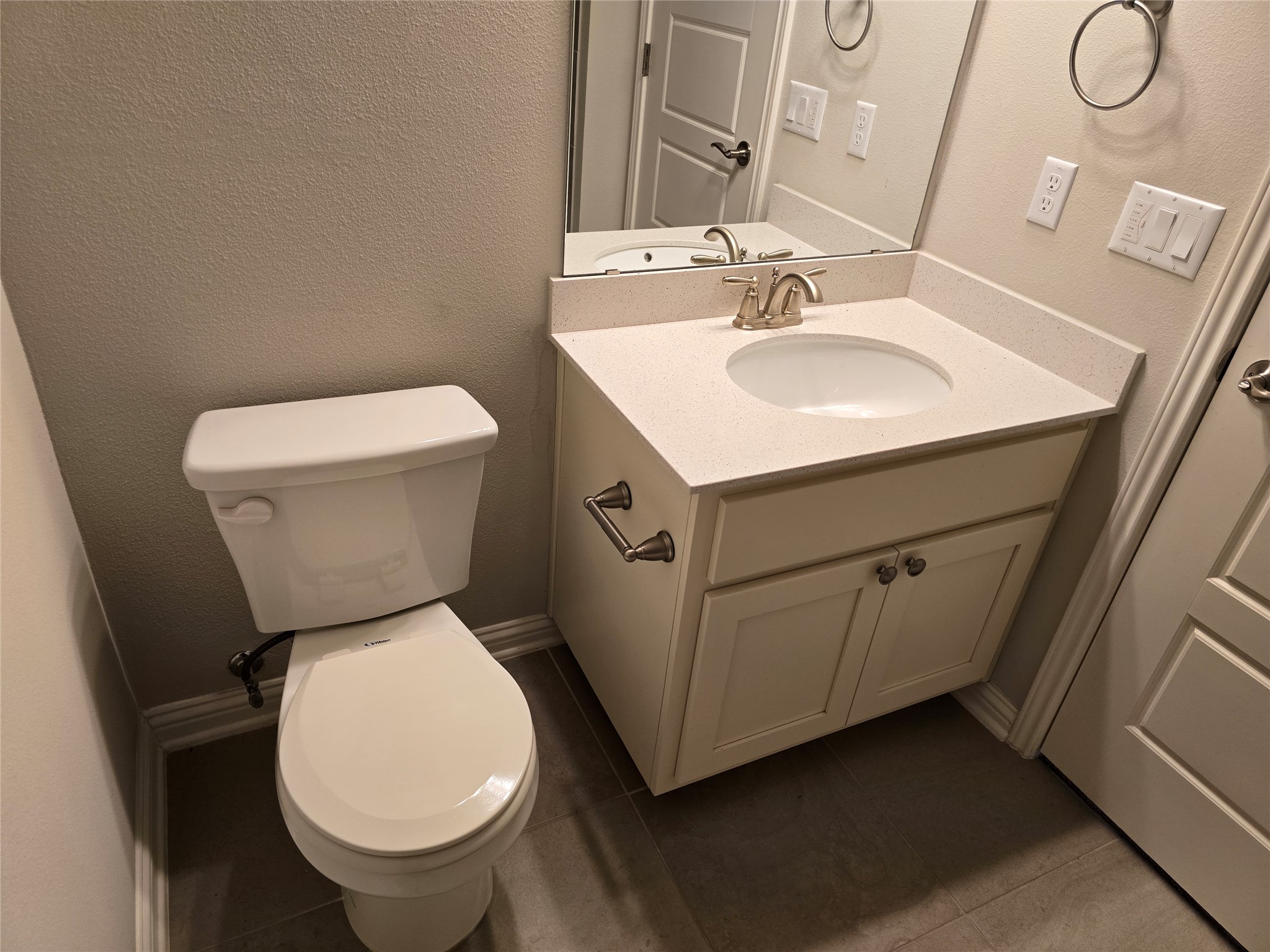 13800 Lyndhurst Street, Unit 233 Austin, TX 78717 - Photo 26 of 38 a white toilet sitting next to a bathroom sink