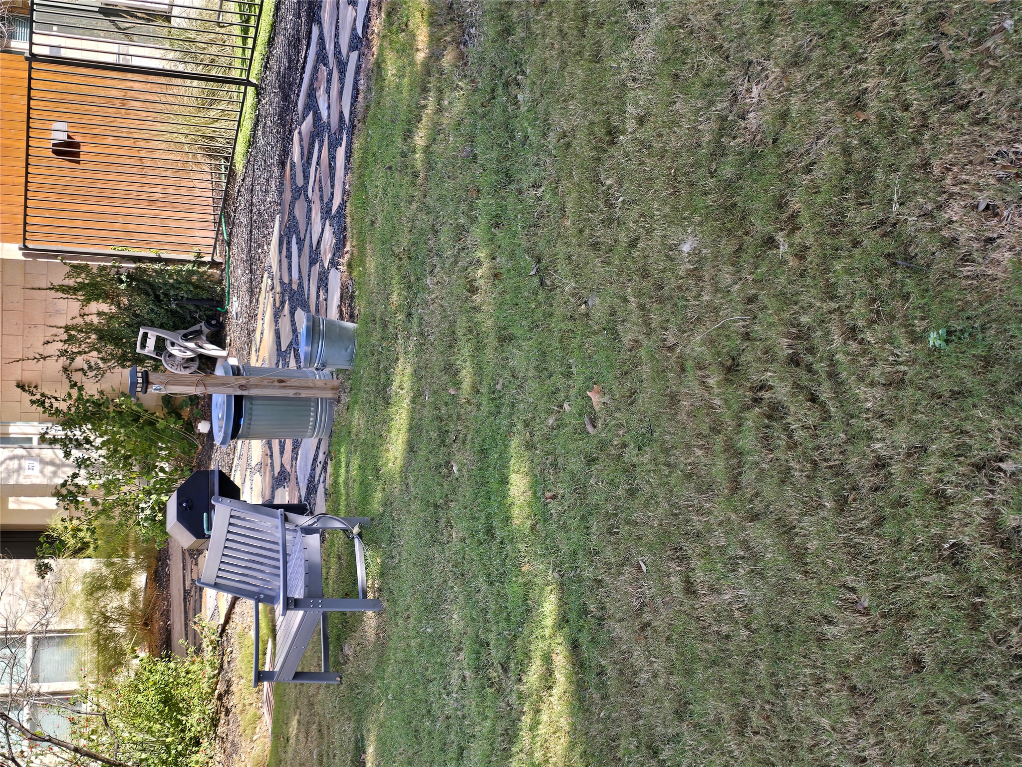 13800 Lyndhurst Street, Unit 233 Austin, TX 78717 - Photo 36 of 38 a backyard of a house with a yard and outdoor seating