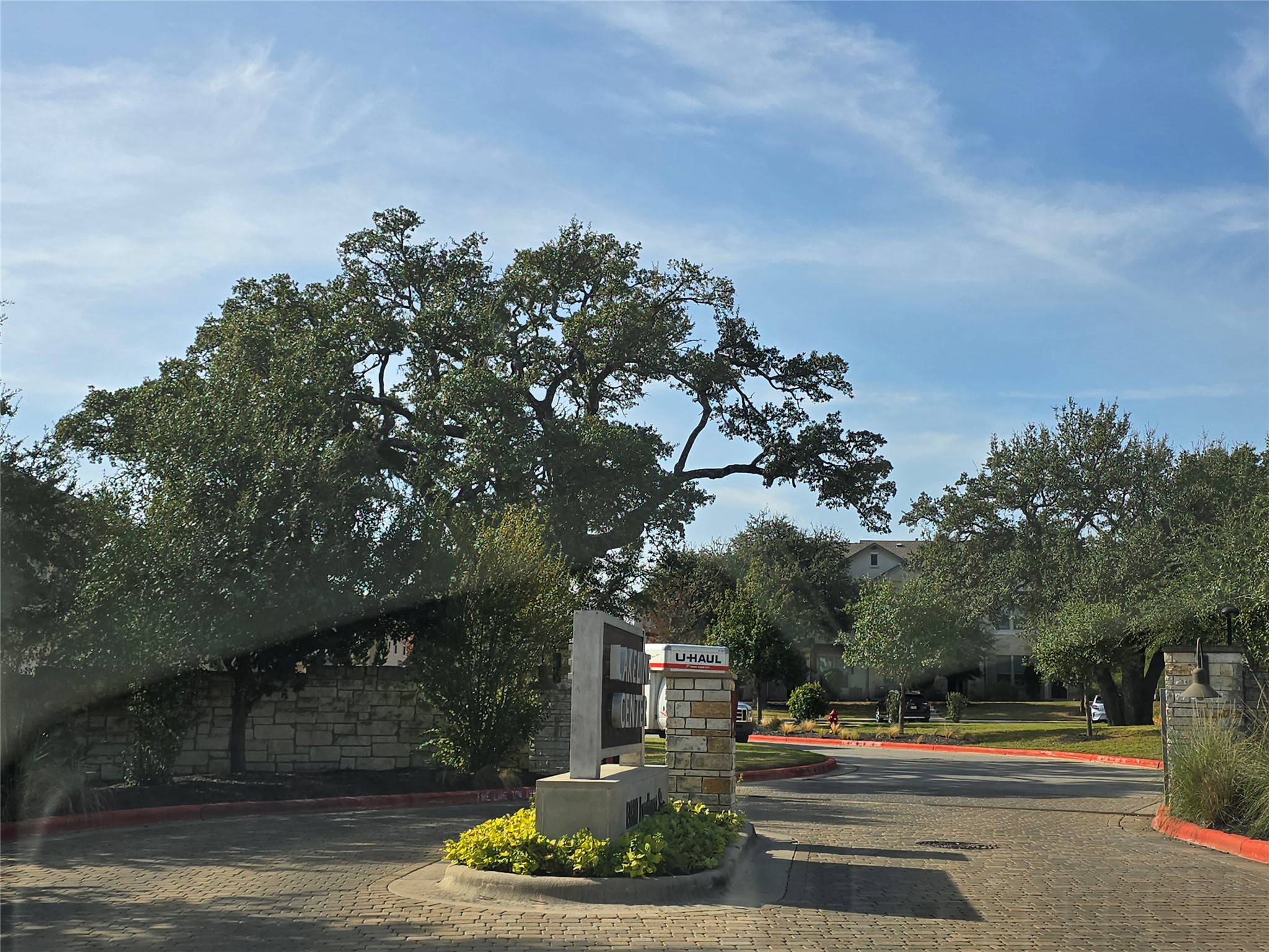 13800 Lyndhurst Street, Unit 233 Austin, TX 78717 - Photo 6 of 38 View of street with curbs and a gated entry